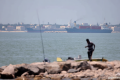UK maritime agency raises Strait of Hormuz threat level after oil tanker reports being struck
