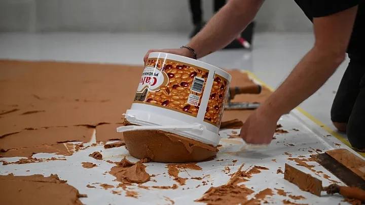 ‘Mind the sticky patch!’: Why has this Dutch museum covered the floor in peanut butter?
