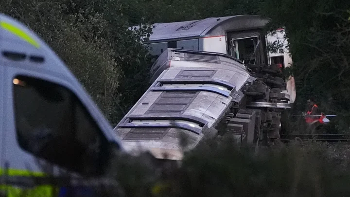 Two injured after train derails in southeast England, emergency services say