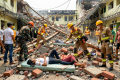 Rescuers search rubble for survivors after New Delhi hostel collapse kills seven